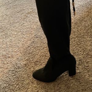 Selling knee-high boots black never worn but I’ve been in my closet